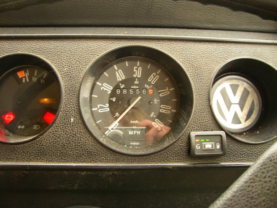 fuel gauge and cross-over switch for LPG gas. The gauge is reading half full.